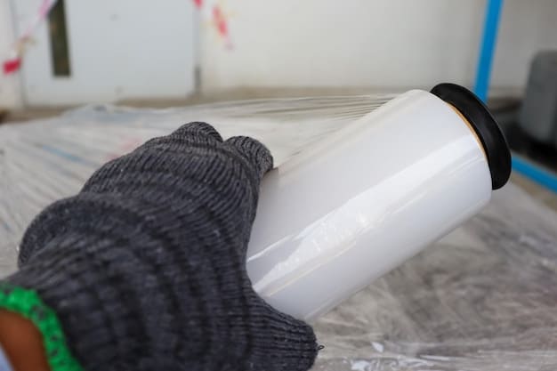 A close-up shot of various insulation materials, including rigid foam, fiberglass batting, and reflective foil, along with waterproofing supplies such as sealant, caulk, and waterproof paint cans.