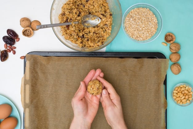 A close show of a dog treat mixture made of sweet potato and oats being balled up and put onto a baking sheet.