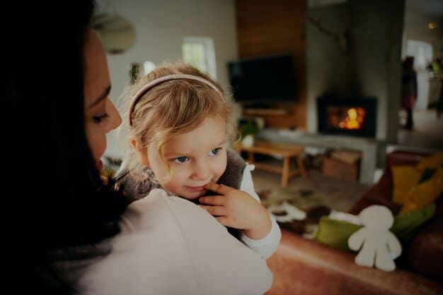 A parent comforting their child who is sitting on the potty, looking upset. The background shows a calm and supportive home environment.