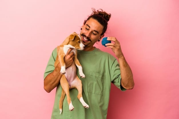 A dog owner holding a clicker and a handful of high-value treats, smiling down at their attentive dog. The dog is sitting patiently, looking up at the owner with its ears perked up, indicating focus and anticipation. The background is a well-maintained park with green grass and trees.