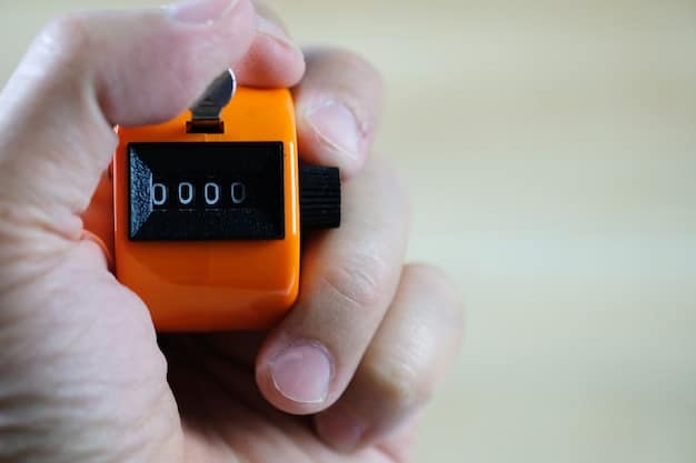 A close-up of a hand pressing a clicker, with a blurred image of a dog in the background, emphasizing the precision and timing required in clicker training.