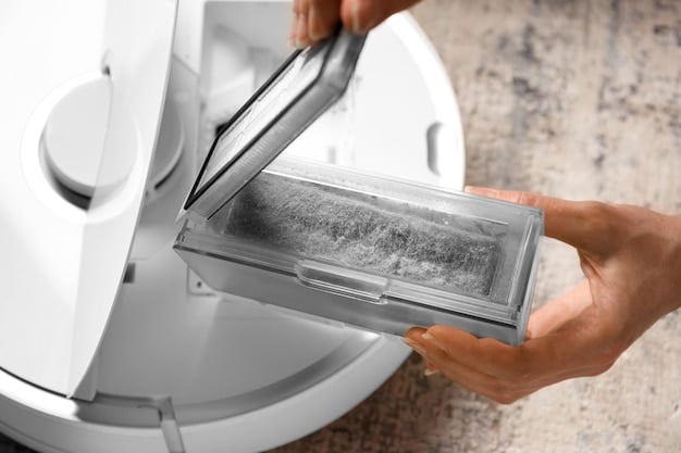 A close-up of someone cleaning an automatic cat litter box, emphasizing the importance of regular maintenance and hygiene to keep the device functioning properly and odor-free.