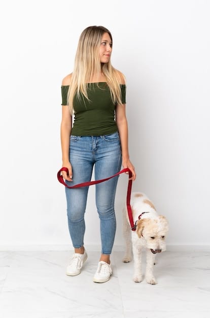 A woman measuring a dog's height and length with a measuring tape. The dog is standing in a natural pose.