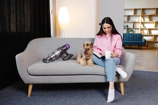 A photo showing a hand holding the Bissell Pet Stain Eraser, highlighting its lightweight and compact design. The background could show a living room setting with pets.